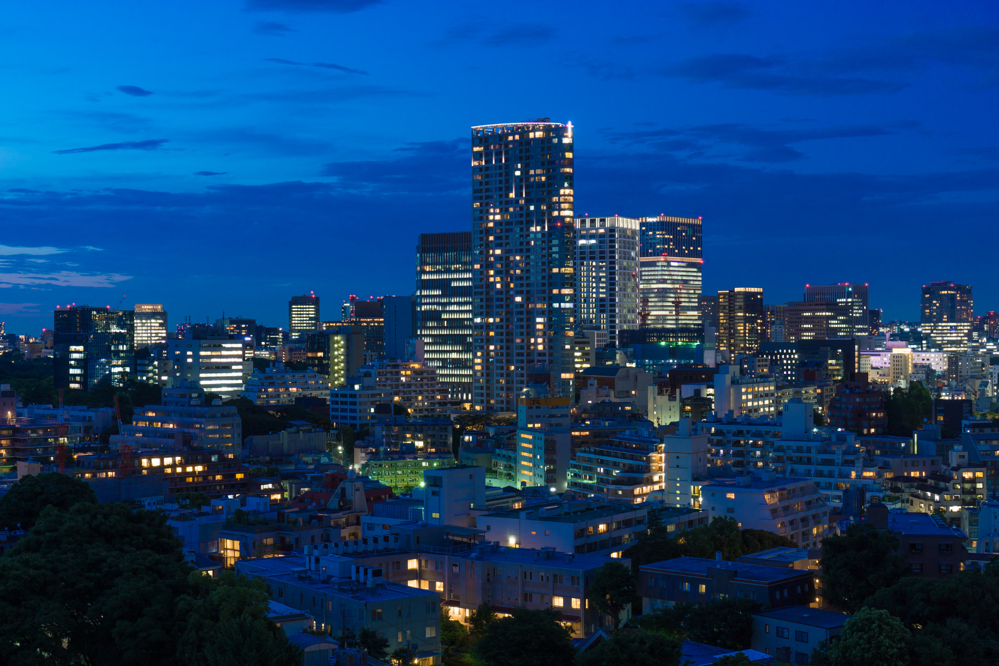 City skyline of a financial district representing the corporate sectors of the stock market